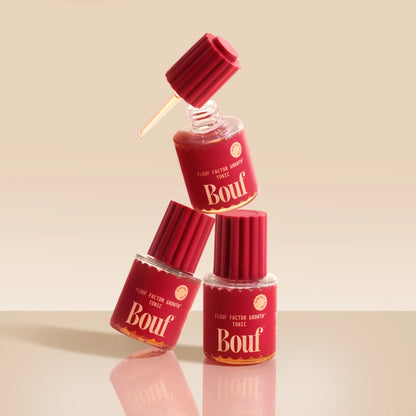 Three red bottles labeled 'Bouf' on a beige background