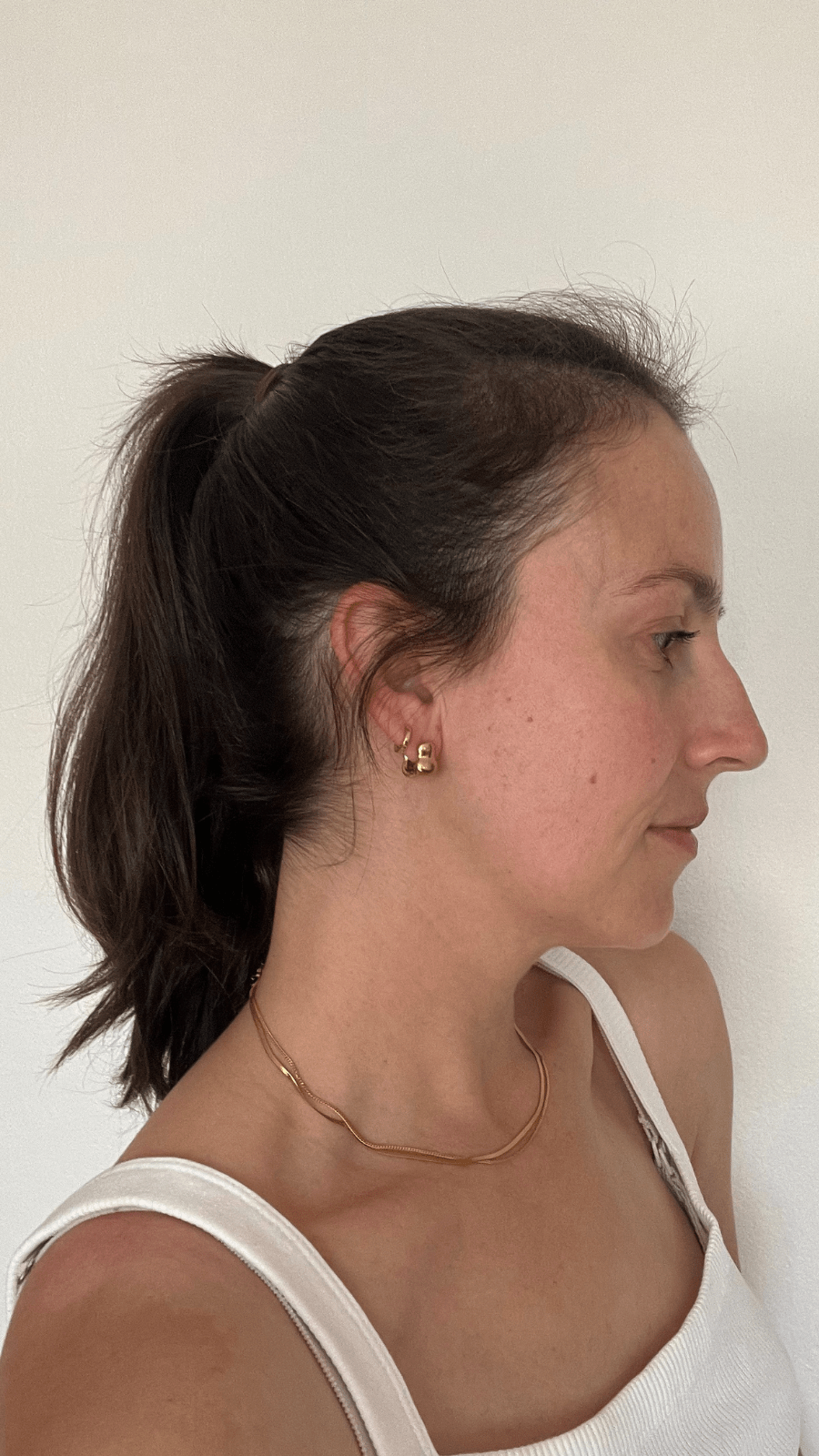 Woman with a ponytail showcasing her hair after using Bouf